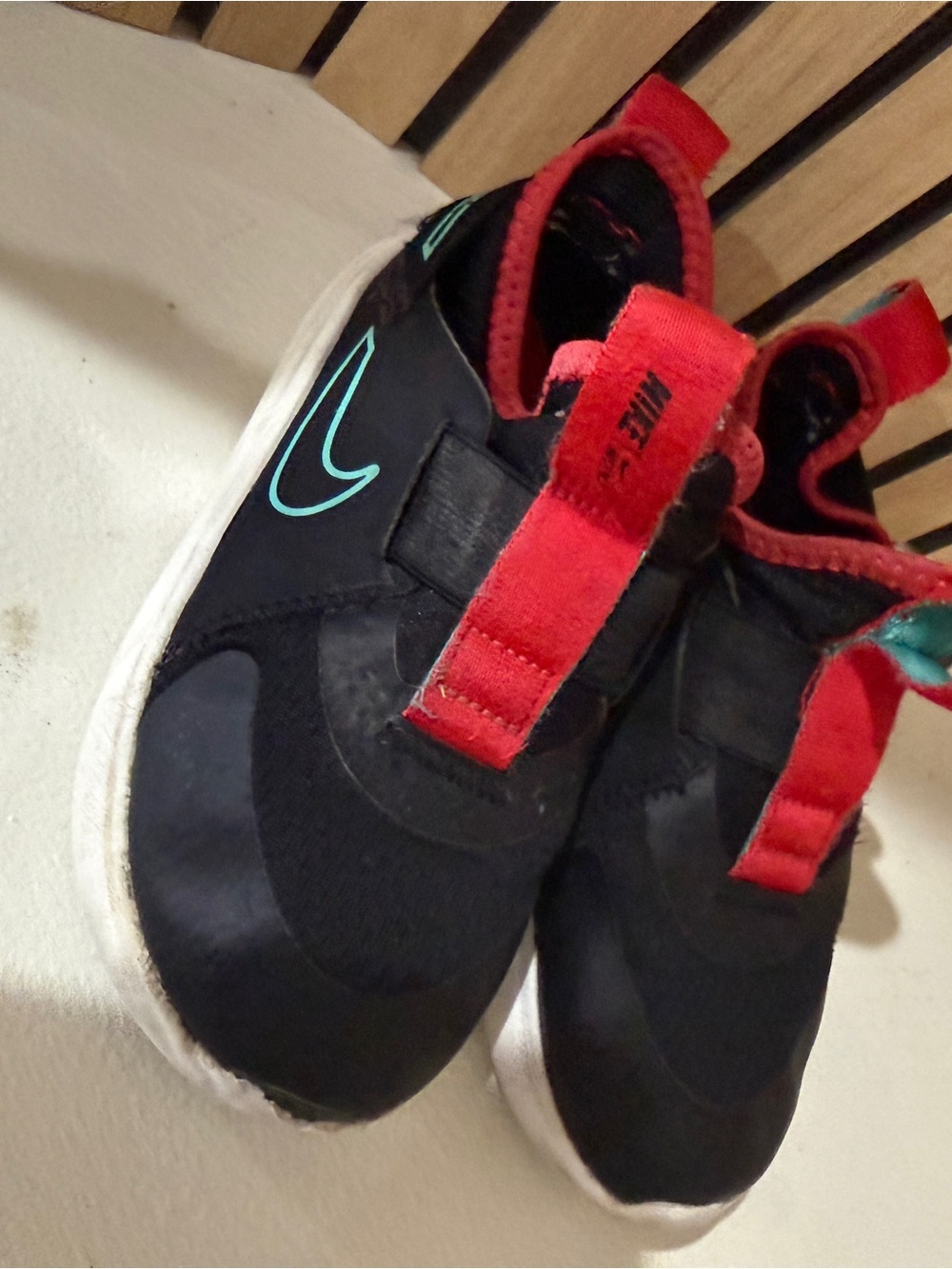 10c Nike Kids Black Slip-On Sneakers with Red and Teal Accents